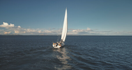 Closeup yacht cruise at open sea aerial. Regatta on luxury sailboat at bay. Picturesque seascape of...