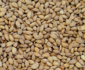A Large Pile of Almonds on a Store Counter Fresh and Aromatic Nut for Healthy Eating