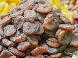 Mountain of Tasty Dried Apricots Against Other Dried Fruits