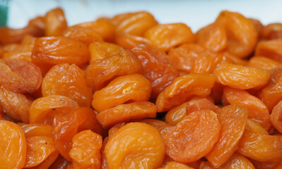 Juicy Dried Apricots on the Backdrop of an Eastern Market: Shades of Sun and Health