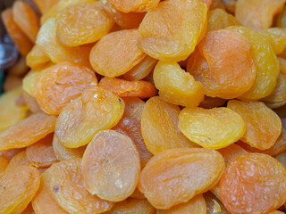 Juicy Dried Apricots on the Backdrop of an Eastern Market: Shades of Sun and Health