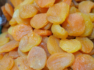 Juicy Dried Apricots on the Backdrop of an Eastern Market: Shades of Sun and Health
