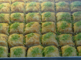 Traditional Baklava with Nuts and Honey, Eastern Delicacies on a Golden Tray