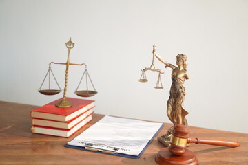 A judge's gavel, a symbol of authority, rests on a grey background. Its weight signifies the...