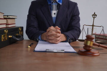 Male lawyer, skilled in jurisprudence, navigates legal matters, drafting contracts, advising...
