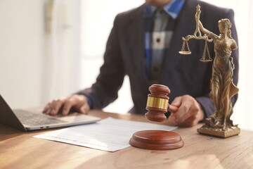 Male lawyer, skilled in jurisprudence, navigates legal matters, drafting contracts, advising clients, representing in court. Law ensures justice, balancing rights and responsibilities