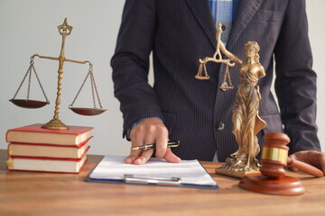 Male lawyer, skilled in jurisprudence, navigates legal matters, drafting contracts, advising...