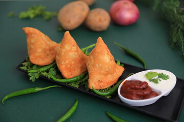Samosa Indian famous street food snack closeup with selective focus and blur