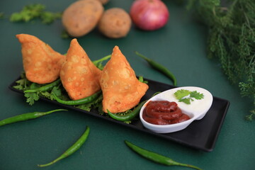 Samosa Indian famous street food snack closeup with selective focus and blur