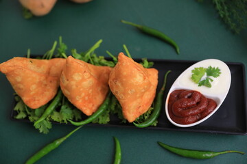 Samosa Indian famous street food snack closeup with selective focus and blur