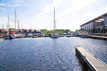 Waterfront with colorful wooden houses in Dutch Reitdiep harbor, Groningen town, Netherlands. - obrazy, fototapety, plakaty