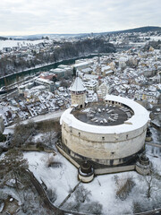 Aerial view of the Swiss old town Schaffhausen in winter, with the medieval castle Munot over the Rhine river. Munot is the landmark of this town.