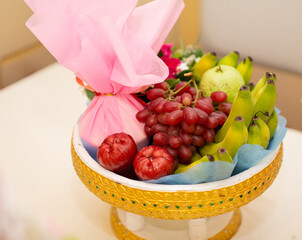 Various fruits placed on a wooden tray Leave blank space for copying and use.