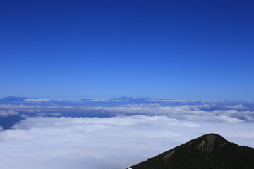 The Northern Alps floating in the sea of clouds seen from the top of Mt.Amigasa