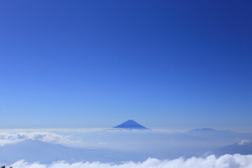 Mt.fuji floating in the sea of clouds seen from the top of Mt.Amigasa