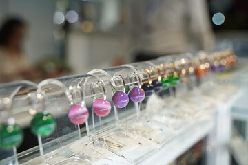 Almaty, Kazakhstan - 04.11.2024 : Gold and silver earrings with processed natural stones.