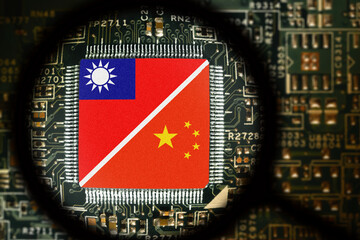 Flags of Taiwan and China on a processor. Computer board with chip. View through magnifying glass