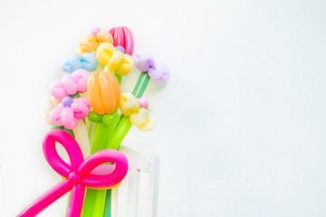 Balloons twisted into a blossoming flower bouquet on white background,Flowers Balloon to decorate the place,bouquet with colorful balloon flowers.