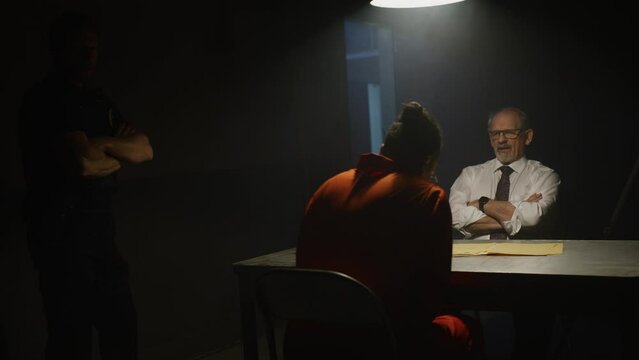 Interrogation in a dark room with detectives