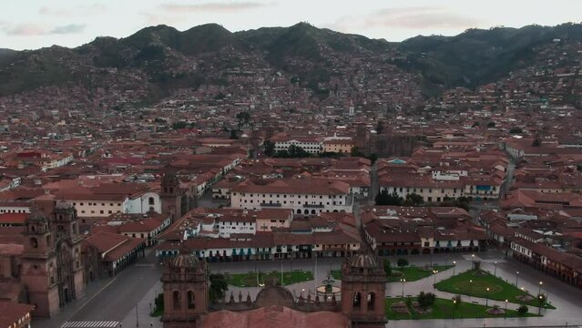 Aerial capturing Cusco's historic city center and an empty Plaza de Armas