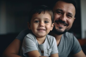A man and a boy are smiling at the camera