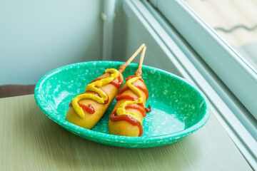 Homemade Korean Corn Dogs with tomato sauce and mustard,Seoul South Korea at street food.