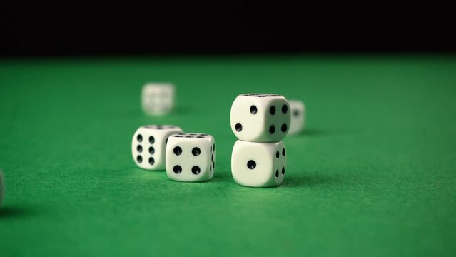 Throwing dice against stacks making other dices fall down.