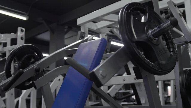 Blue chest press machine inside a sports gym club