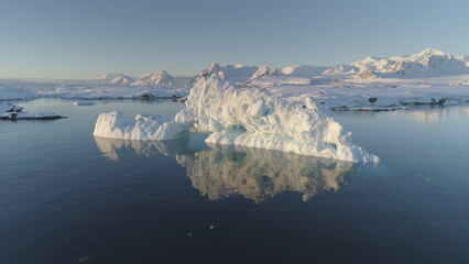 Slow Motion View - Iceberg Melt in Clear Ocean Water. Huge Ice with Reflection Float in Winter...