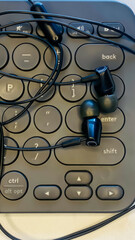 Earphone and keyboard in office business work