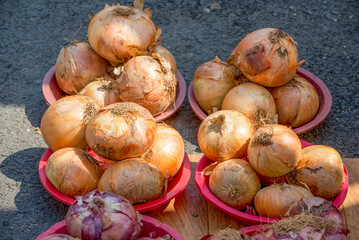 Close up of baskets full of onions sold at the market