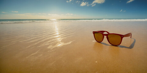 Sunglasses in summer beach sand, travel, tourism, recreation, copy space area