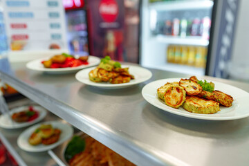 Assorted Gourmet Dishes Displayed on Shelves in a Modern Deli