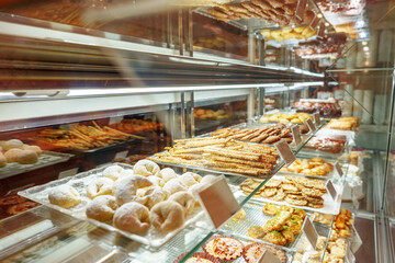 Delectable Assortment of Pastries and Sweets on Display at a Bakery Shop