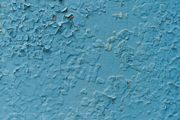 Old cracked paint on fence closeup. Texture, grunge texture, old cracked paint on fence close-up