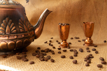 kettle, copper cups and coffee beans