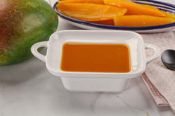 Sweet mango puree in the bowl