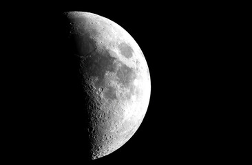 Clear view of a first quarter moon phase (53%)