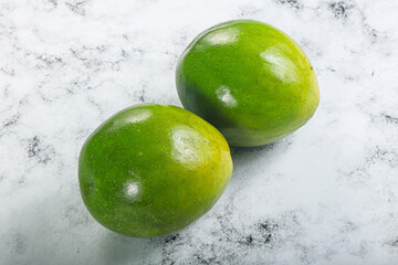 Two ripe green exotic avocado fruit