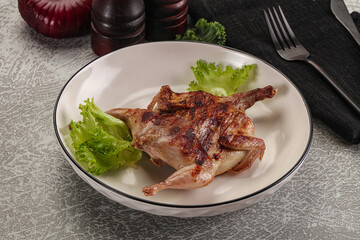Grilled quail in the plate