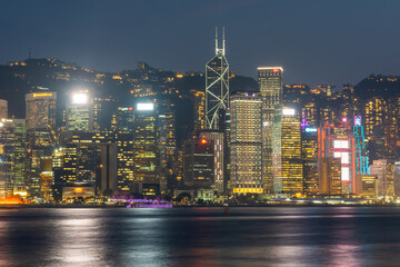 Cityscape of Hongkong Skyline from Victoria Harbour during evening and night in Tsim Sha Tsui , Hongkong : 26 March 2024