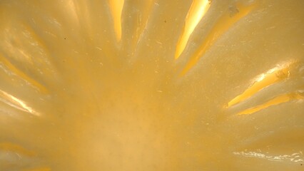 The pineapple slice, creating a sense of freshness. A close-up of a sliced pineapple reveals a...