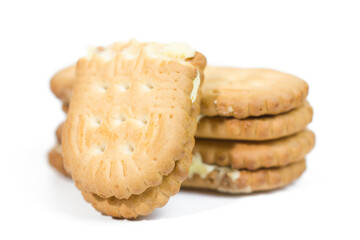 Sandwich biscuits, filled with melon cream, half cutted, isolated on white background