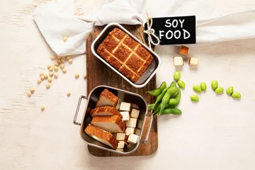  Soy food. Baked tofu cheese on a board, soybeans. Vegan product © bit24