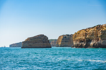 Fototapeta na wymiar Coastal view of the beaches and caves in Algarve, Portugal.