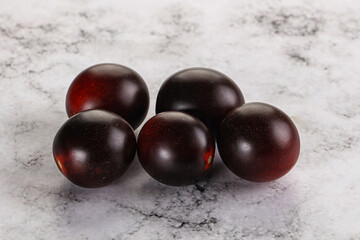 Raw ripe black kumato tomato