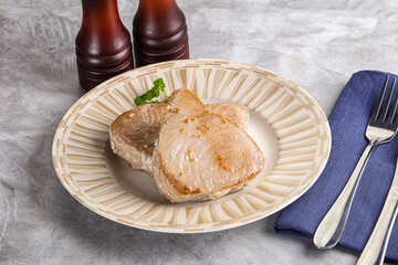 Roasted red tuna steak in the plate