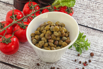 Marinated green capers in the bowl