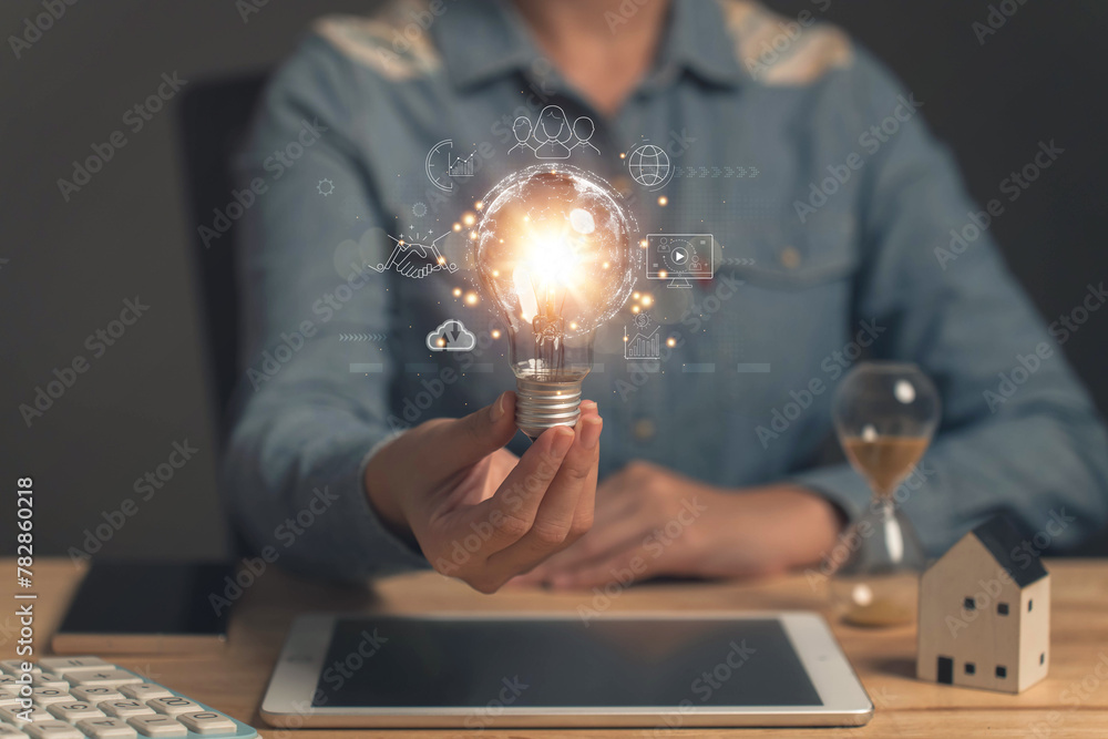 Poster global business and digital marketing.businessman holding a light bulb. internet connection. interne