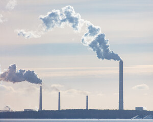 Smoke from the chimneys of a metallurgical plant in winter